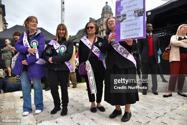 Suffragettes attend the official unveiling of a statue of suffragist and women's rights campaigner Millicent Fawcett in Parliament Square on April...
