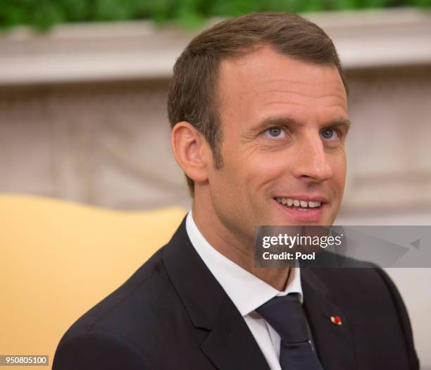 President Emmanuel Macron of France speaks to the media during a meeting with President Donald Trump April 24, 2018 in the Oval Office at the White...