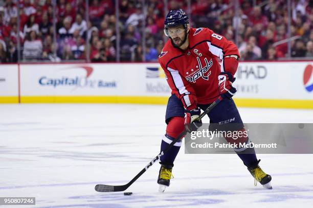 Alex Ovechkin of the Washington Capitals skates with the puck in the first period against the Columbus Blue Jackets in Game Five of the Eastern...