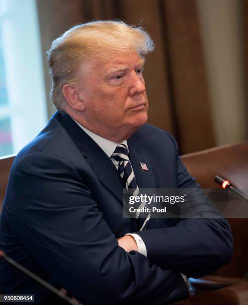 President Donald Trump speaks to the media during a meeting with President Emmanuel Macron of France April 24, 2018 at the White House in Washington,...