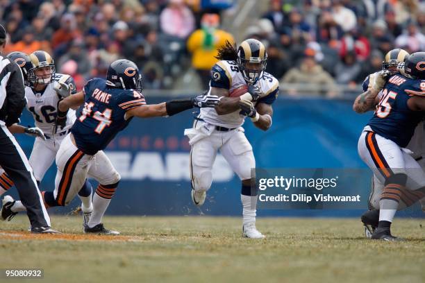 Steven Jackson of the St. Louis Rams rushes against the Chicago Bears at Soldier Field on December 6, 2009 in Chicago, Illinois. The Bears beat the...