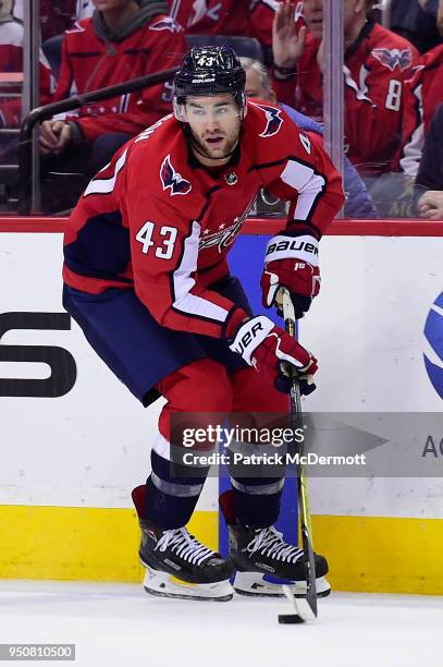 Tom Wilson of the Washington Capitals skates with the puck in the third period against the Columbus Blue Jackets in Game Five of the Eastern...