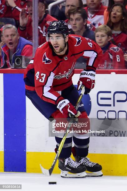 Tom Wilson of the Washington Capitals skates with the puck in the third period against the Columbus Blue Jackets in Game Five of the Eastern...