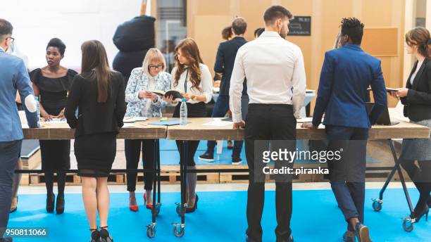 business team working - exhibition stock pictures, royalty-free photos & images