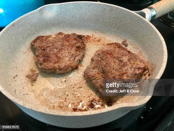 frying cube steak in a frypan - freshness guard stock pictures, royalty-free photos & images