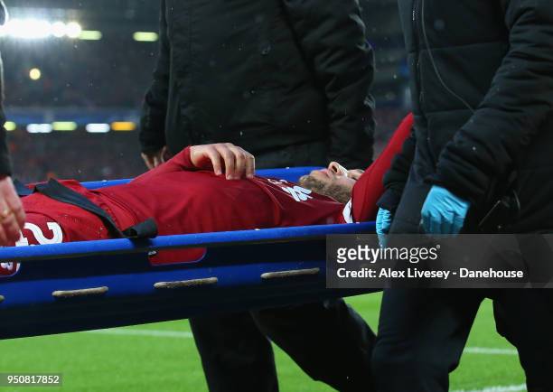 Alex Oxlade-Chamberlain of Liverpool is stretchered off during the UEFA Champions League Semi Final First Leg match between Liverpool and A.S. Roma...