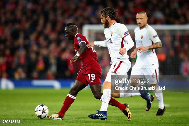 Sadio Mane of Liverpool passes the ball away from Daniele De Rossi of AS Roma during the UEFA Champions League Semi Final First Leg match between...