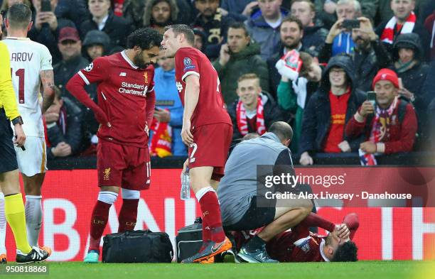 Alex Oxlade-Chamberlain of Liverpool lies injiured during the UEFA Champions League Semi Final First Leg match between Liverpool and A.S. Roma at...