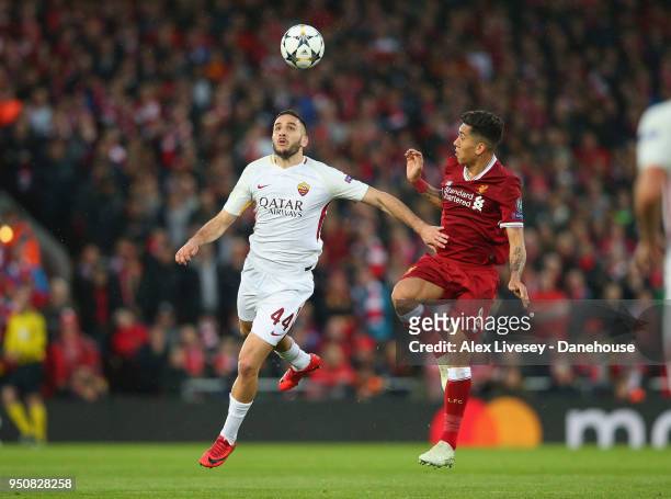 Kostas Manolas of A.S. Roma challenges Roberto Firmino of Liverpool during the UEFA Champions League Semi Final First Leg match between Liverpool and...