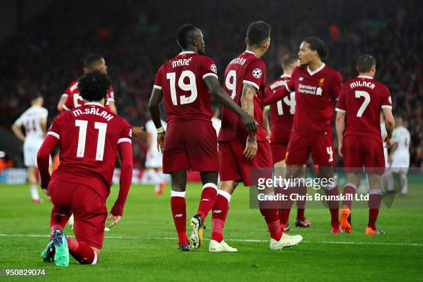 Mohamed Salah of Liverpool celebrates after scoring his sides second goal during the UEFA Champions League Semi Final First Leg match between...