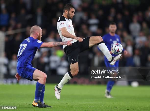Bradley Johnson of Derby County beats Aron Gunnarsson of Cardiff City to the ball during the Sky Bet Championship match between Derby County and...
