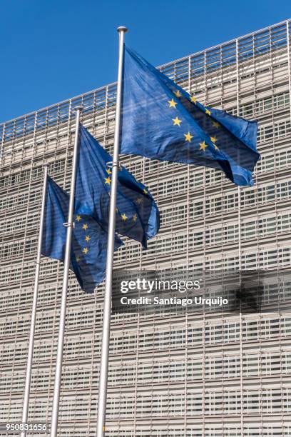 european union flags at berlaymont building of the european commission - european union symbol stock pictures, royalty-free photos & images