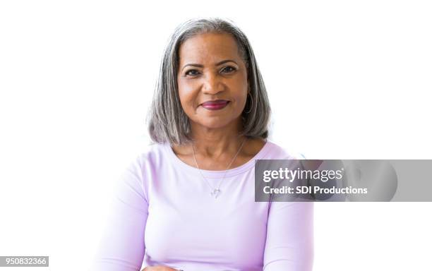 portrait of attractive african american senior woman - senior adult white background stock pictures, royalty-free photos & images