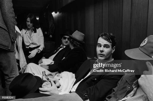 Dan Aykroyd and John Belushi of The Blues Brothers backstage with friends at The Winterland Ballroom in 1978 in San Francisco, California.