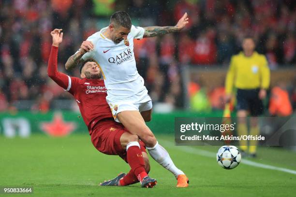 Alex Oxlade-Chamberlain of Liverpool injures himself challenging Aleksandar Kolarov of A.S.Roma during the UEFA Champions League Semi Final First Leg...