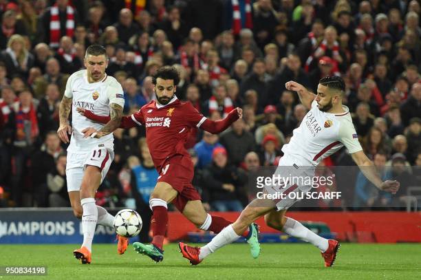 Liverpool's Egyptian midfielder Mohamed Salah vies with Roma's Croatian defender Aleksandar Kolarov and Roma's Czech striker Patrik Schick during the...