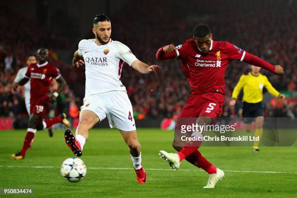 Georginio Wijnaldum of Liverpool takes a shot as Kostas Manolas of AS Roma attempts to block during the UEFA Champions League Semi Final First Leg...