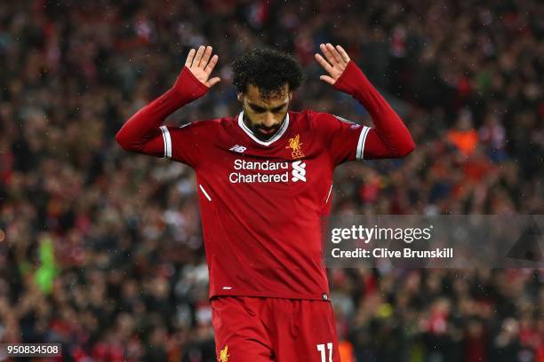 Mohamed Salah of Liverpool celebrates as he scores his sides second goal during the UEFA Champions League Semi Final First Leg match between...