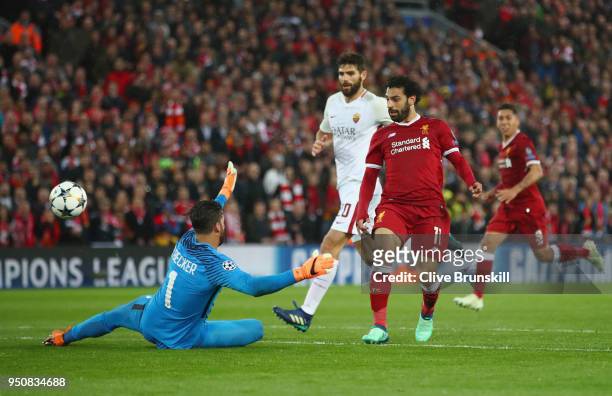 Mohamed Salah of Liverpool scores his sides second goal past Alisson Becker of AS Roma during the UEFA Champions League Semi Final First Leg match...