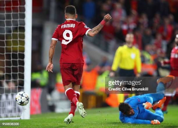Roberto Firmino of Liverpool scores his sides fourth goal past Alisson Becker of AS Roma during the UEFA Champions League Semi Final First Leg match...