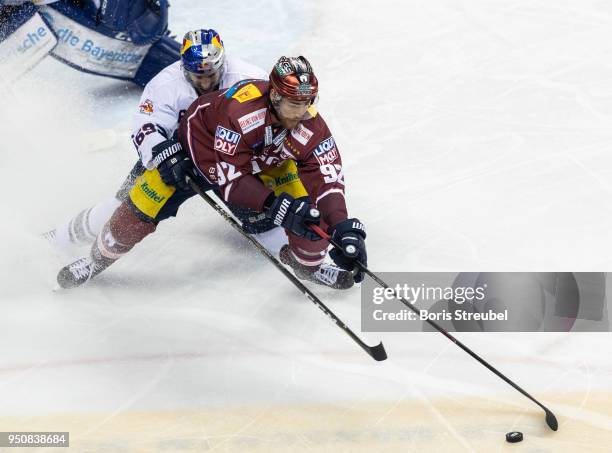 Marcel Noebels of Eisbaeren Berlin in action with Florian Kettemer of Red Bull Muenchen during the DEL Playoff final match 6 between Eisbaeren Berlin...