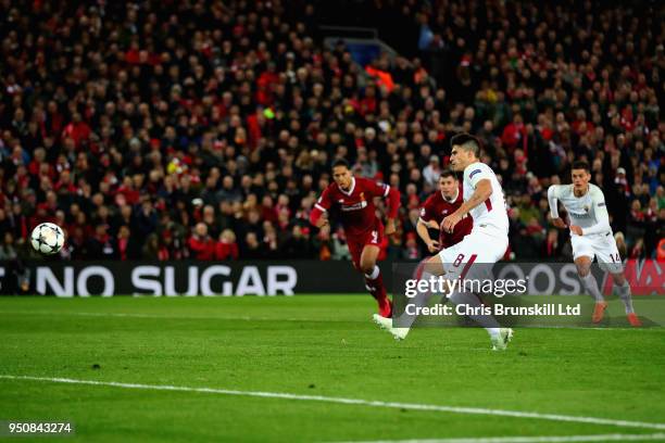 Diego Perotti of AS Roma scores his sides second goal from the penalty spot during the UEFA Champions League Semi Final First Leg match between...