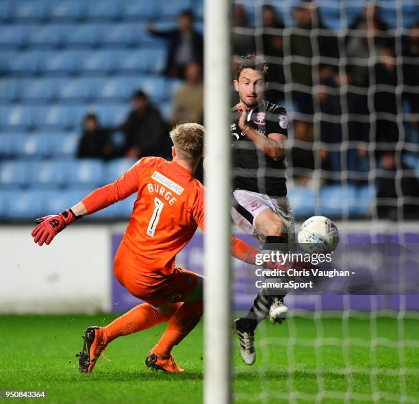 Lincoln City's Lee Frecklington beats Coventry City's Lee Burge to score his sides fourth goal during the Sky Bet League Two match between Coventry...