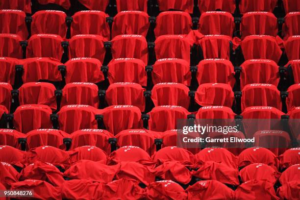 T shirts are displayed over fans chairs prior to Game Three of Round One of the 2018 NBA Playoffs between the Oklahoma City Thunder and Utah Jazz on...