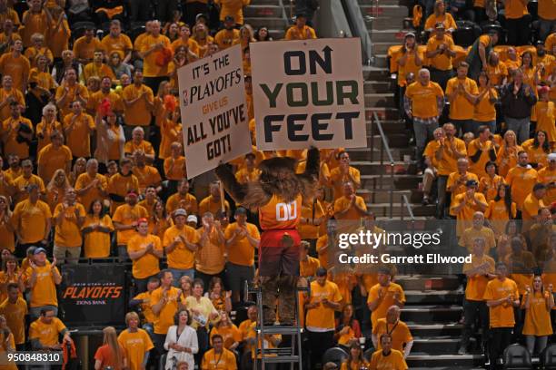 Jazz Bear holds signs during Game Three of Round One of the 2018 NBA Playoffs between the Oklahoma City Thunder and Utah Jazz on April 21, 2018 at...