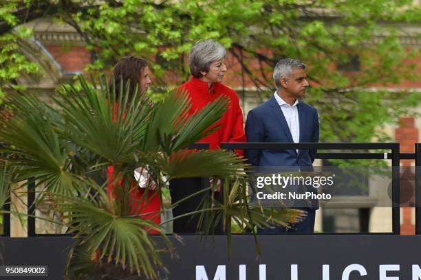 British Prime Minister Theresa May and Mayor of London Sadiq Kahn are pictured during the official unveiling of a statue in honour of the first...