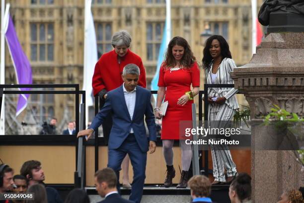 British Prime Minister Theresa May and Mayor of London Sadiq Kahn are pictured during the official unveiling of a statue in honour of the first...