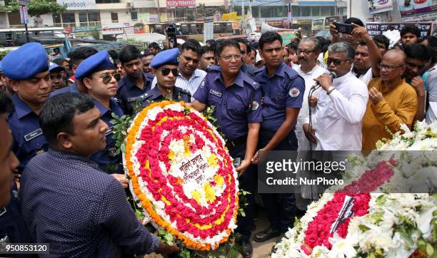 Floral wreath placed at the base of the hammer and scythe monument in Savar on the occasion of five years of Rana Plaza disaster in Dhaka, Bangladesh...