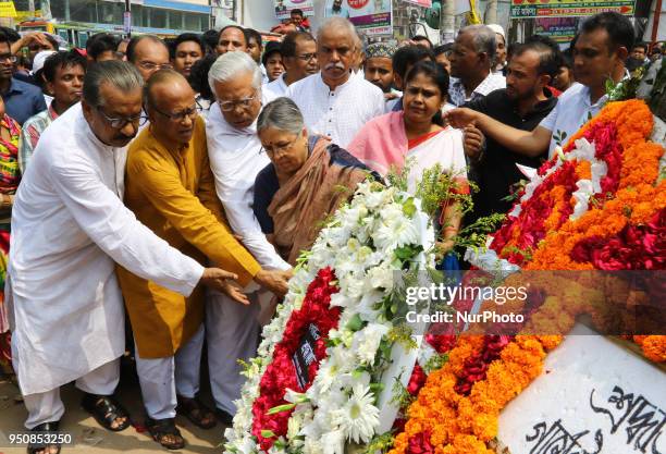 Floral wreath placed at the base of the hammer and scythe monument in Savar on the occasion of five years of Rana Plaza disaster in Dhaka, Bangladesh...