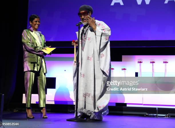 Host Journalist, Edward R. Murrow Award Recipient Tamron Hall and Pioneer and Founding Father of Hip Hop DJ Kool Herc speak on stage during Tribeca...