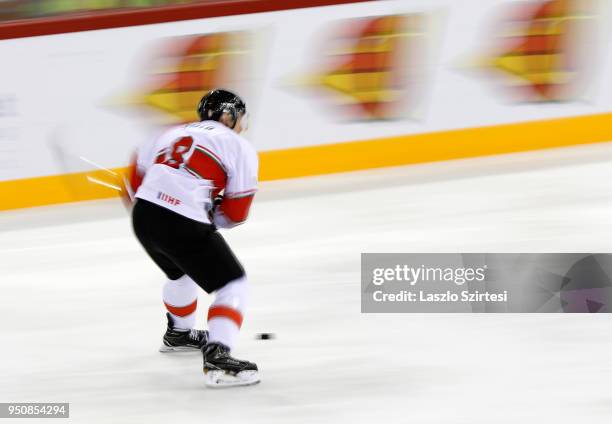 Vilmos Gallo of Hungary controls the puck during the 2018 IIHF Ice Hockey World Championship Division I Group A match between Italy and Hungary at...