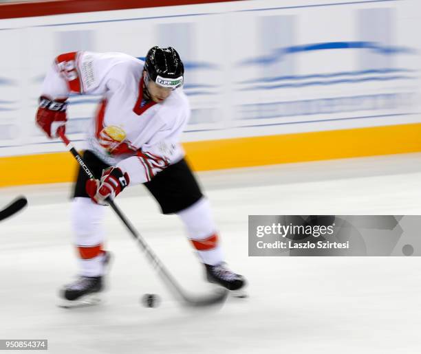 Janos Hari of Hungary controls the puck during the 2018 IIHF Ice Hockey World Championship Division I Group A match between Italy and Hungary at...