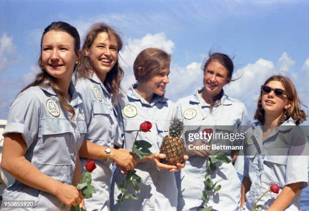 Celebrating their return to the surface following a two-week stay on the bottom of the Caribbean in underwater research project Tektite 2, women...