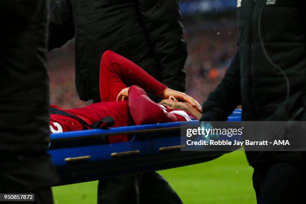 Alex Oxlade-Chamberlain of Liverpool goes off on a stretcher during the UEFA Champions League Semi Final First Leg match between Liverpool and A.S....