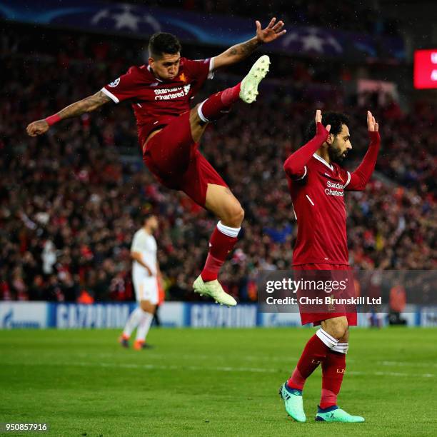 Mohamed Salah of Liverpool and teammate Roberto Firmino celebrate after scoring his sides second goal during the UEFA Champions League Semi Final...