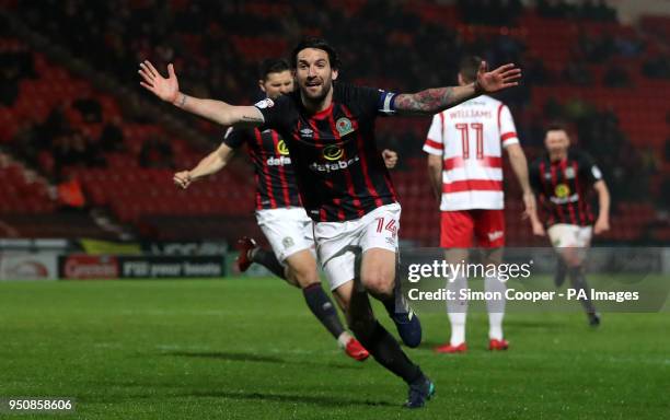 Blackburn Rovers' Charlie Mulgrew celebrates scoring his side's first goal of the game during the Sky Bet League One match at the Keepmoat Stadium,...