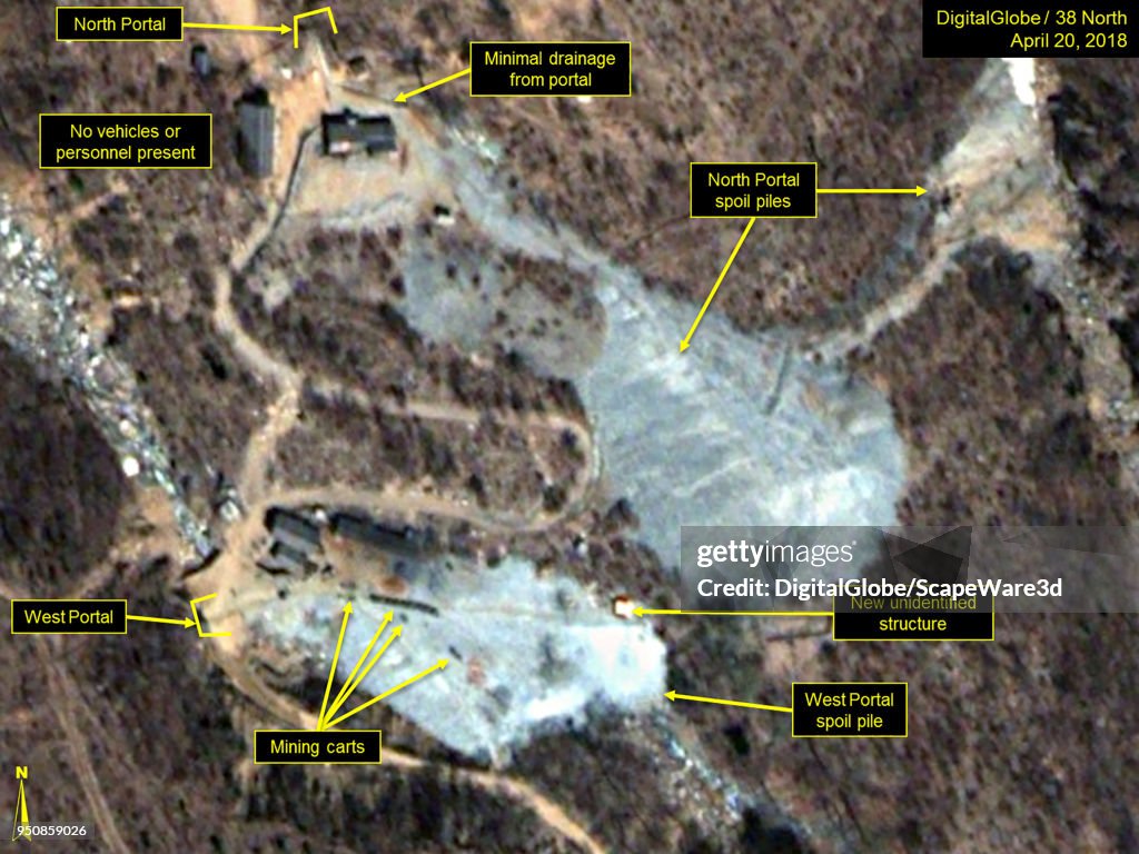 APRIL 20, 2018. Figure 2. A train of mining carts and new structure are present at the West Portal spoil pile.