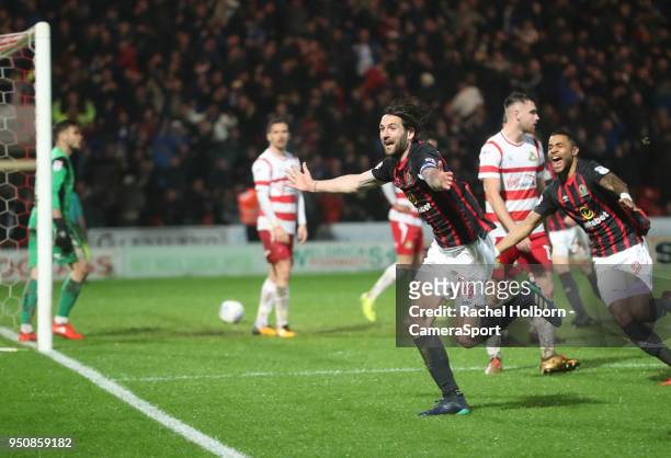 Blackburn Rovers' Charlie Mulgrew celebrates scoring the goal that sees his side promoted during the Sky Bet League One match between Doncaster...