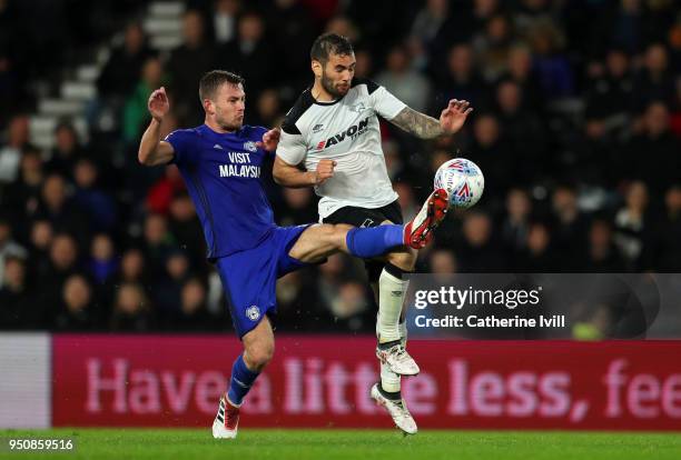 Joe Ralls of Cardiff City tackles Bradley Johnson of Derby County during the Sky Bet Championship match between Derby County and Cardiff City at iPro...