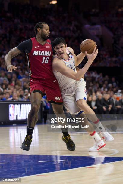 Ersan Ilyasova of the Philadelphia 76ers drives to the basket against James Johnson of the Miami Heat during Game Two of the first round of the 2018...