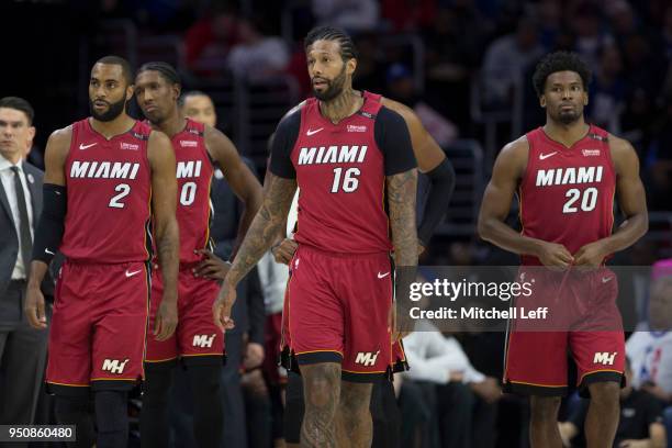 Wayne Ellington, Josh Richardson, James Johnson and Justise Winslow of the Miami Heat walk on the court after a timeout against the Philadelphia...