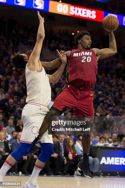 Justise Winslow of the Miami Heat controls the ball against Dario Saric of the Philadelphia 76ers during Game Two of the first round of the 2018 NBA...
