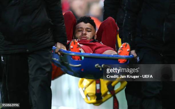 Alex Oxlade-Chamberlain of Liverpool leaves the pitch on a stretcher during the UEFA Champions League Semi Final First Leg match between Liverpool...