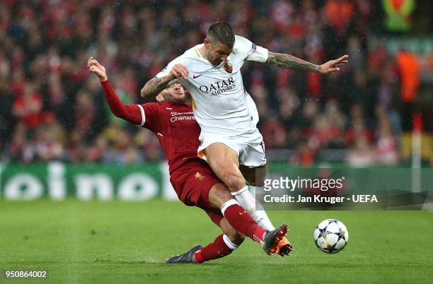 Aleksandar Kolarov of A.S Roma is tackled by Alex Oxlade-Chamberlain of Liverpool during the UEFA Champions League Semi Final First Leg match between...