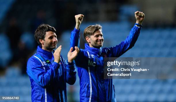 Lincoln City manager Danny Cowley, left, and Lincoln City's assistant manager Nicky Cowley celebrate at the end of the Sky Bet League Two match...