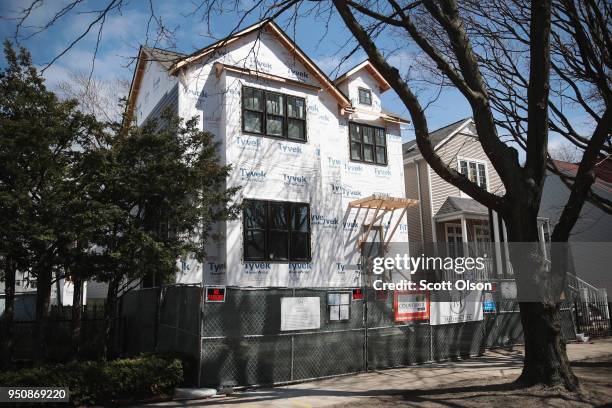 Home under construction is offered for sale on April 24, 2018 in Chicago, Illinois. New home sales surged in the U.S. In March, following increases...